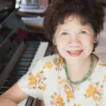 Woman testimonial at piano